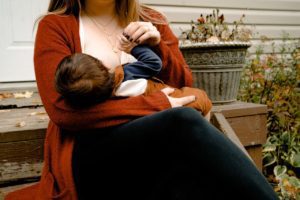 mother breastfeeding baby deciding about getting a diaphragm as birth control